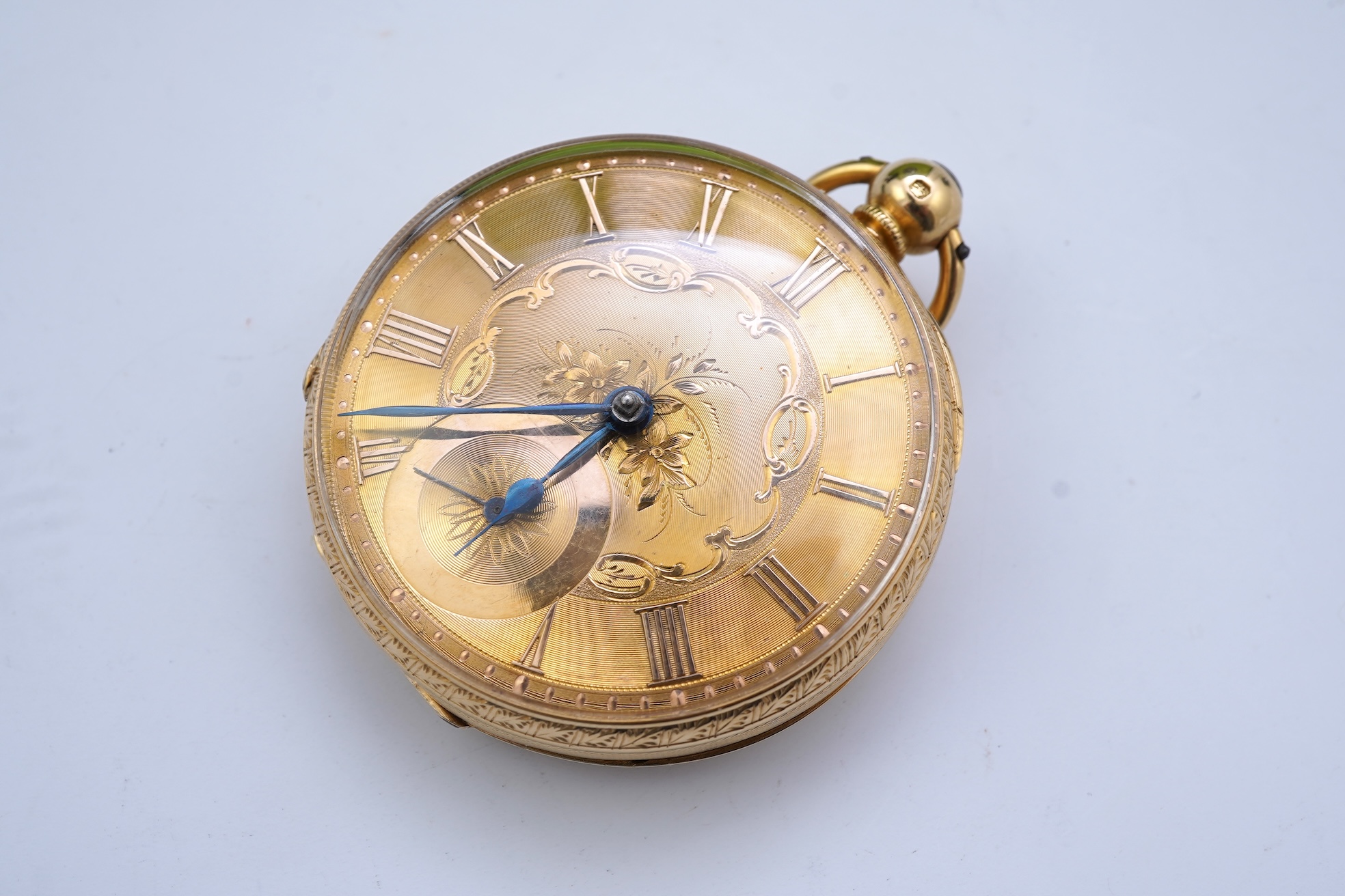 A Victorian engraved 18ct gold open faced key wind pocket watch